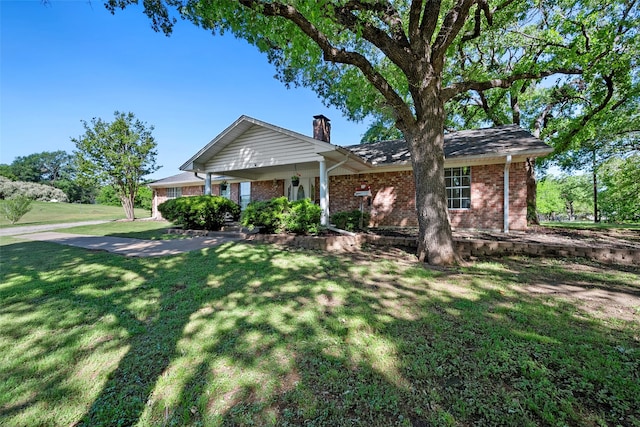 ranch-style house with a front lawn