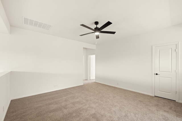 carpeted empty room with ceiling fan