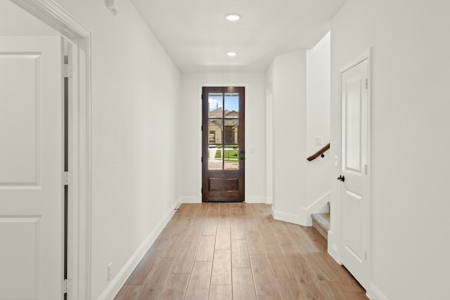 foyer entrance with light hardwood / wood-style floors