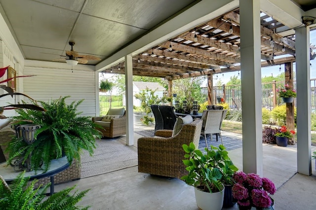 view of patio with outdoor lounge area, ceiling fan, and a pergola