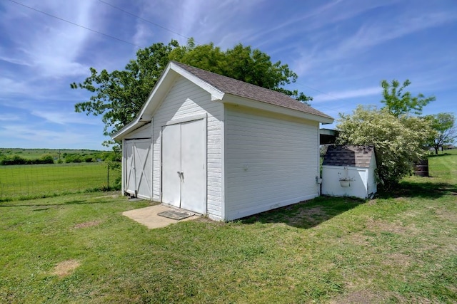 view of outdoor structure with a yard