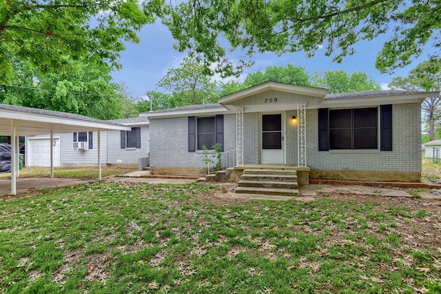 ranch-style home with a carport and a front lawn