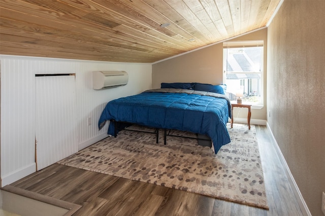 bedroom featuring lofted ceiling, wood-type flooring, an AC wall unit, and wooden ceiling