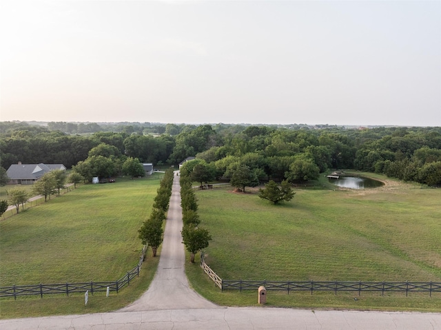 aerial view featuring a water view and a rural view