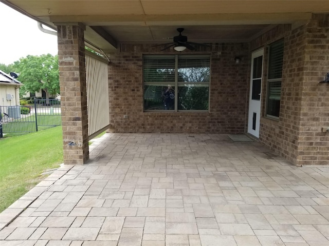 view of patio / terrace featuring ceiling fan and fence