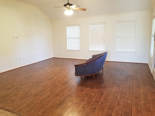 unfurnished room featuring ornamental molding, vaulted ceiling, a ceiling fan, and dark wood-type flooring