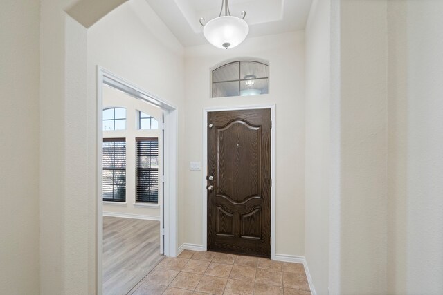 entryway featuring light tile patterned flooring