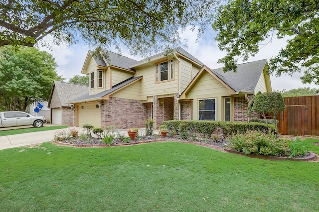 view of front of property featuring a garage and a front lawn