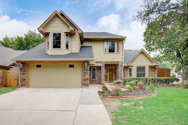 view of front of home with a front lawn and a garage