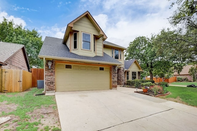 view of front of property with a front yard, a garage, and cooling unit