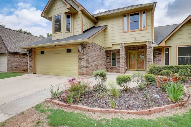 view of front of home featuring covered porch and a garage