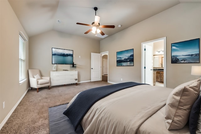 carpeted bedroom featuring ceiling fan, vaulted ceiling, and ensuite bathroom