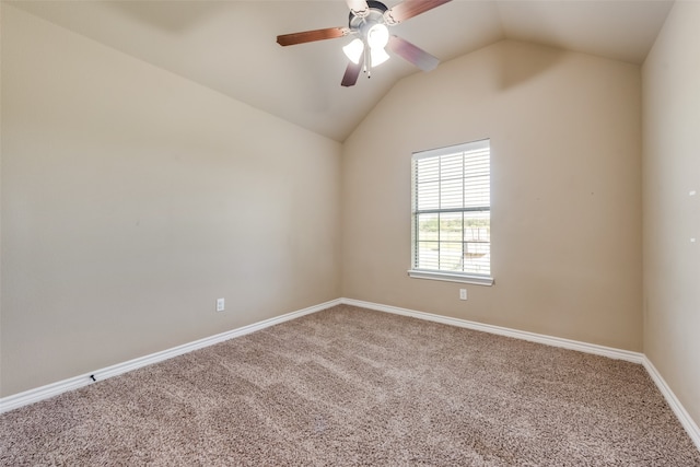 empty room with carpet, lofted ceiling, and ceiling fan