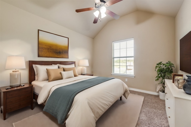 bedroom with lofted ceiling, ceiling fan, and light colored carpet