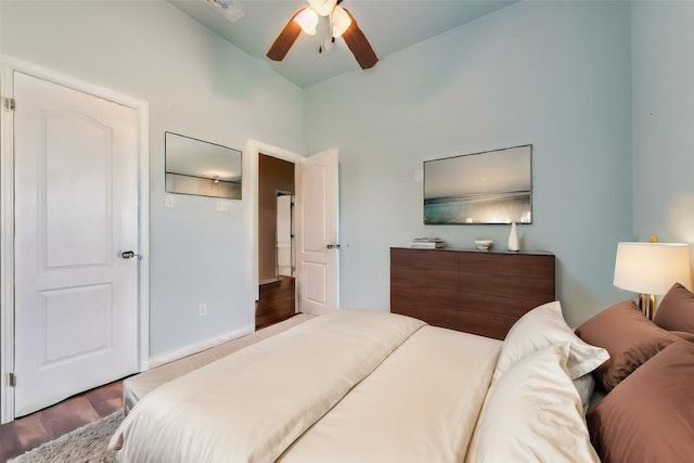 bedroom featuring high vaulted ceiling, ceiling fan, and hardwood / wood-style flooring