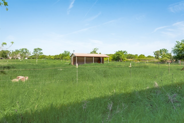 view of yard with a rural view