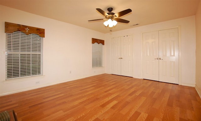 bathroom with toilet, vanity with extensive cabinet space, and tile flooring