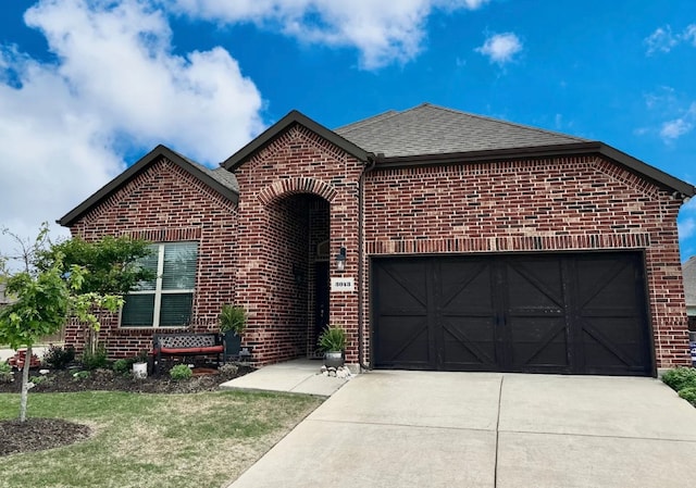 view of front of property with a garage