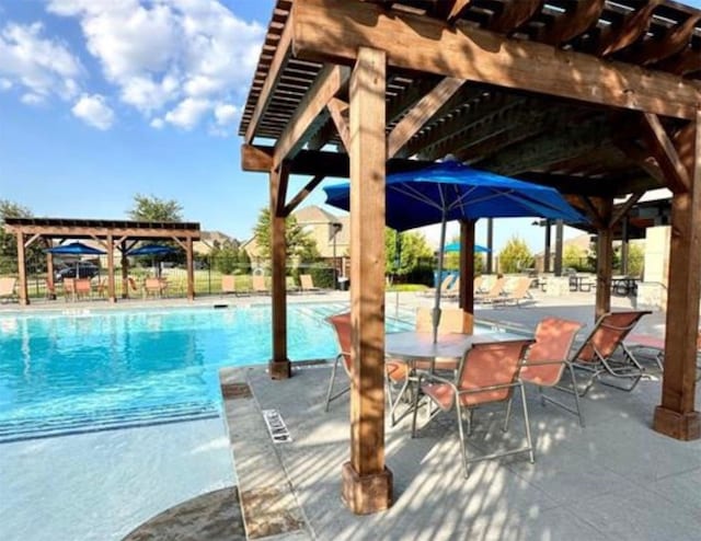 view of pool with a pergola