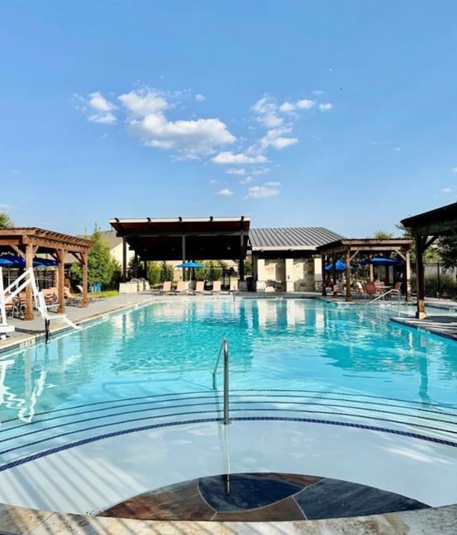 view of pool with a pergola