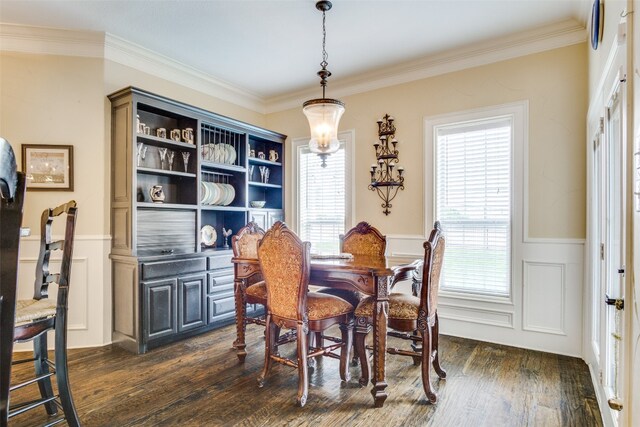 dining room featuring crown molding and dark wood-type flooring