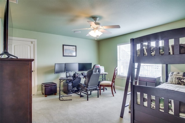 bedroom with light colored carpet and ceiling fan