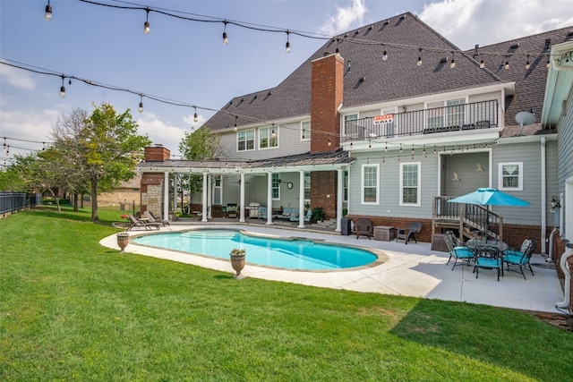 view of pool featuring a patio area and a lawn