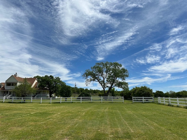 view of yard with a rural view