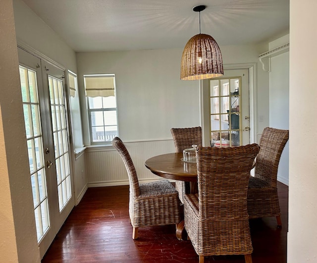 dining space featuring dark hardwood / wood-style flooring and french doors