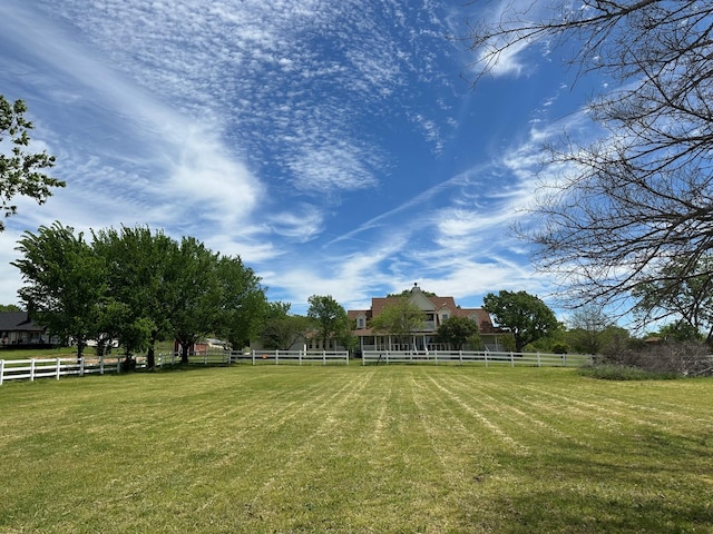 view of yard with a rural view