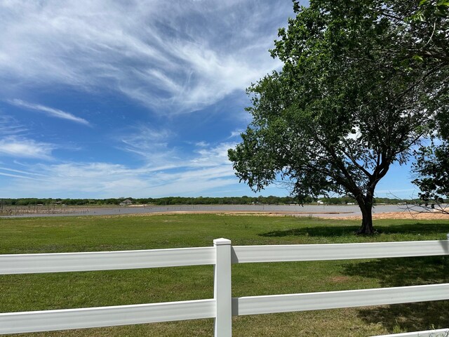 view of yard with a rural view