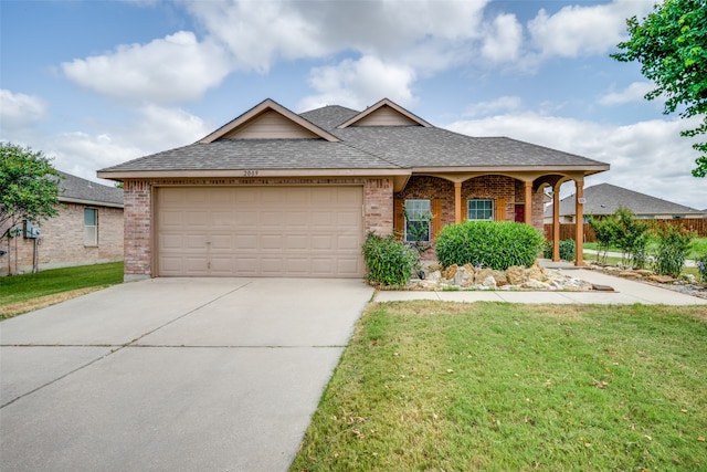 view of front facade featuring a garage and a front lawn