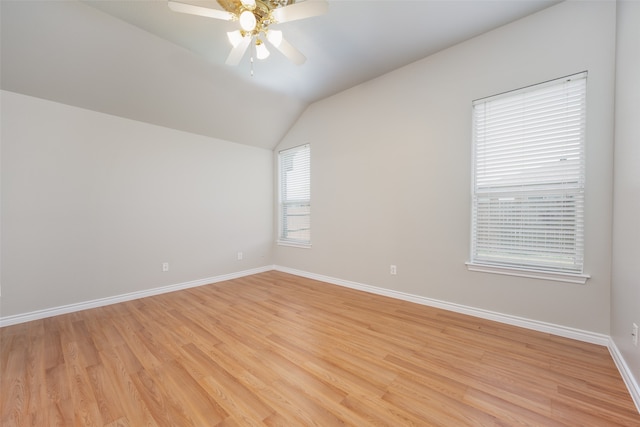 empty room with light hardwood / wood-style floors, vaulted ceiling, and ceiling fan