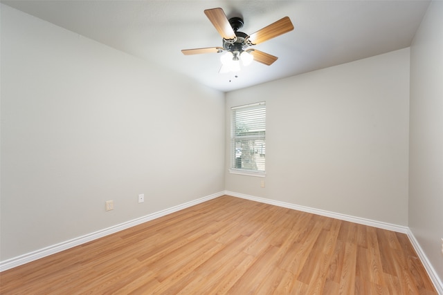 spare room featuring light wood-type flooring and ceiling fan