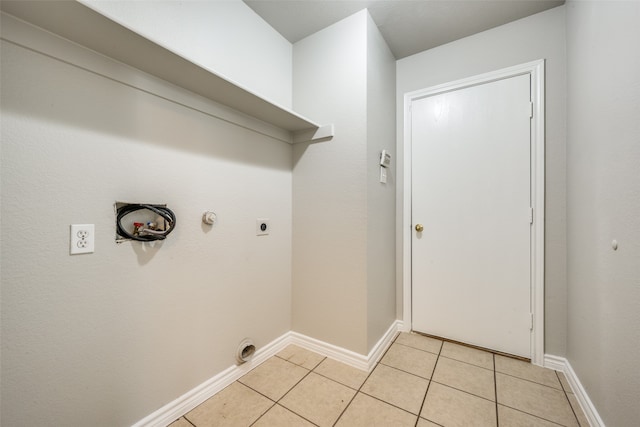 washroom featuring hookup for an electric dryer, hookup for a gas dryer, hookup for a washing machine, and light tile patterned floors