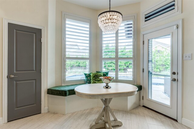 doorway featuring a chandelier