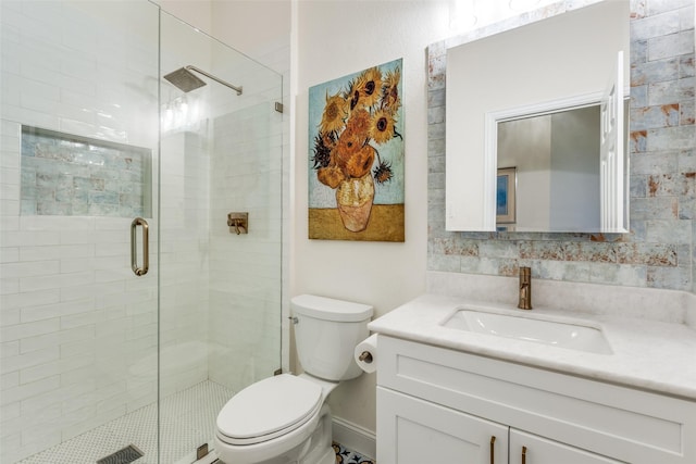 bathroom with a stall shower, visible vents, vanity, and toilet