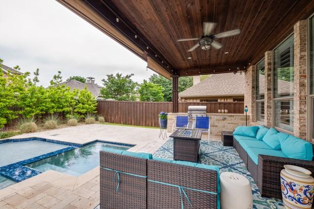 view of patio featuring ceiling fan, an outdoor kitchen, an outdoor living space, and grilling area