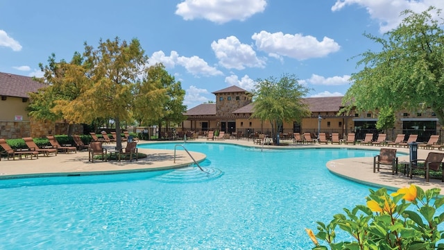 view of swimming pool featuring a patio area