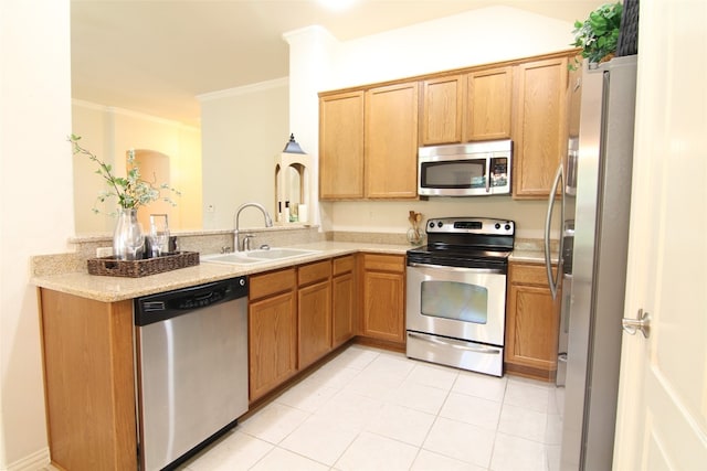 kitchen featuring light stone countertops, crown molding, appliances with stainless steel finishes, sink, and light tile floors