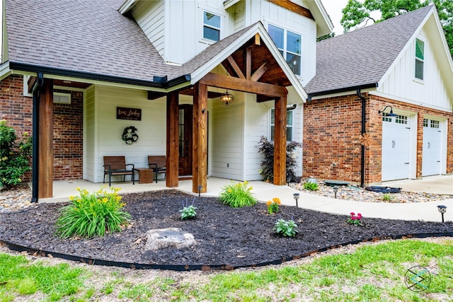 view of front facade with a garage and a porch