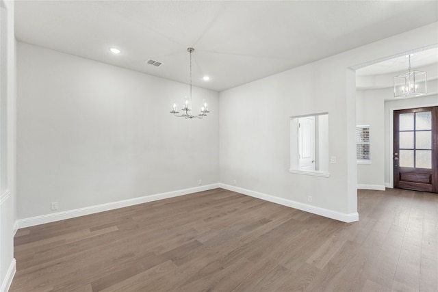 interior space featuring a chandelier and hardwood / wood-style floors