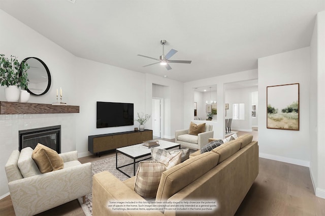 living room featuring ceiling fan and light wood-type flooring