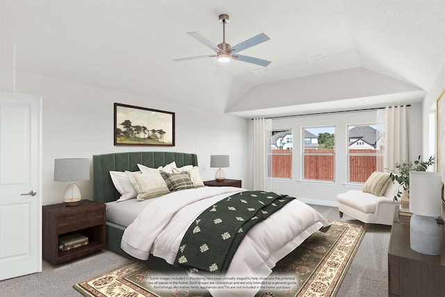 carpeted bedroom featuring lofted ceiling and ceiling fan