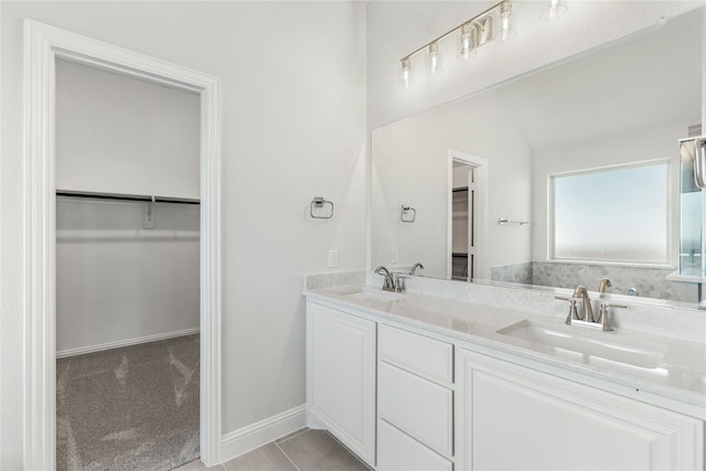 bathroom featuring vanity, lofted ceiling, and tile patterned flooring