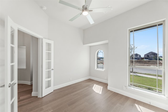 unfurnished room featuring light hardwood / wood-style floors and ceiling fan