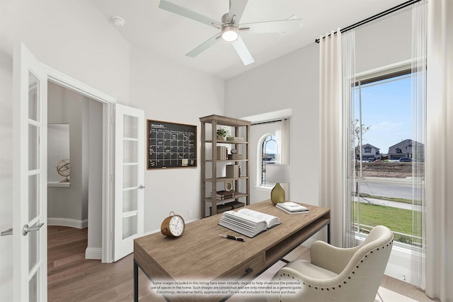 office with ceiling fan and light hardwood / wood-style flooring