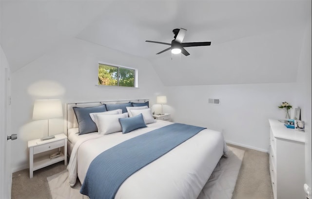 carpeted bedroom featuring ceiling fan and lofted ceiling