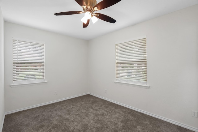 spare room featuring ceiling fan, carpet floors, and plenty of natural light