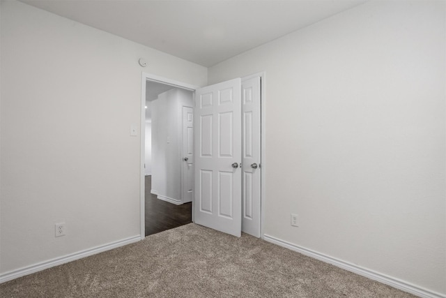 spare room featuring dark hardwood / wood-style floors